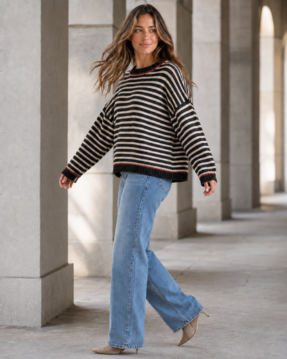 Kira Striped Dropped-Shoulder Sweater in Black, turning side view