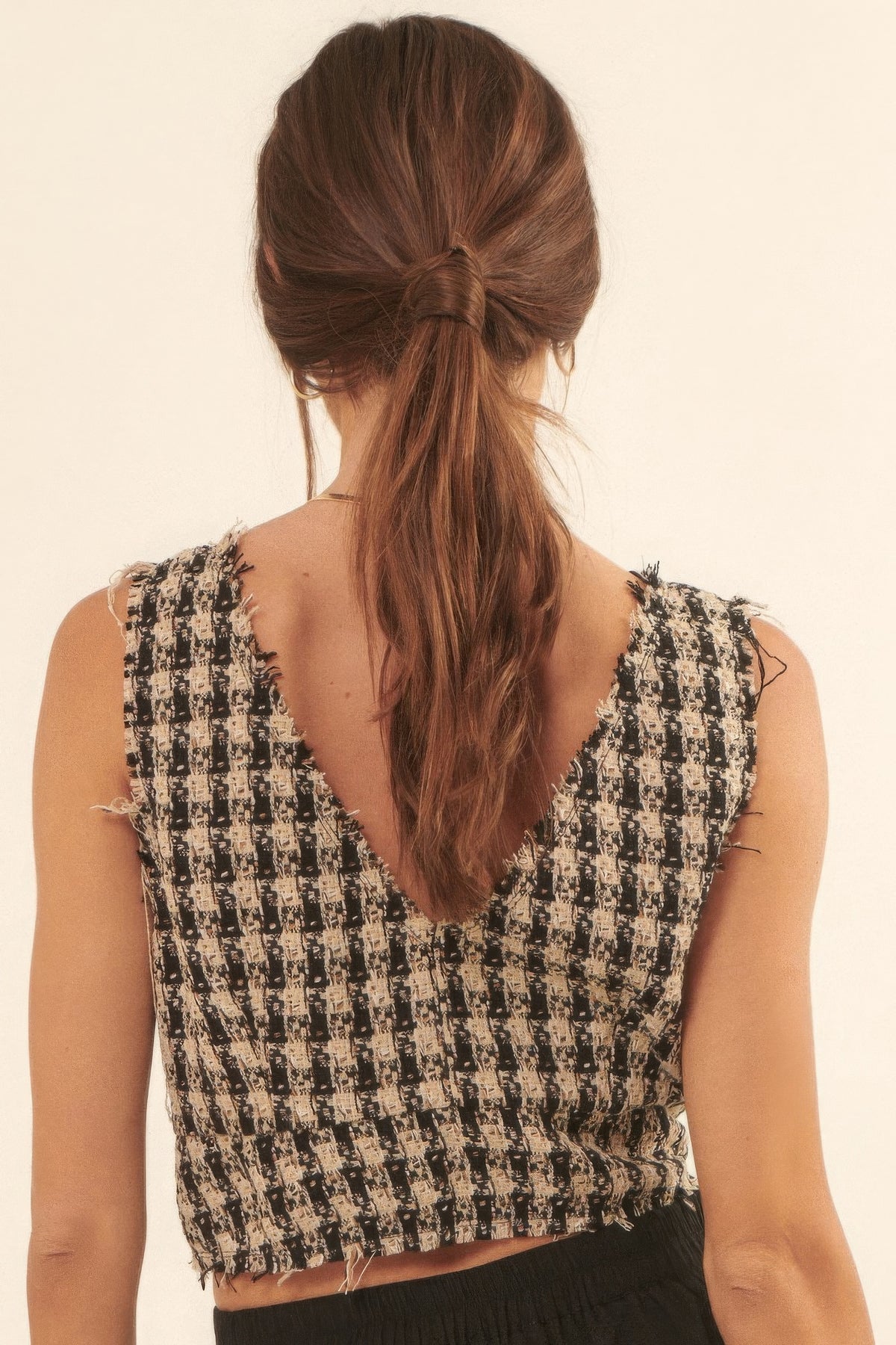 Back view of the Greer Fringed Tweed Vest showing the V back neckline