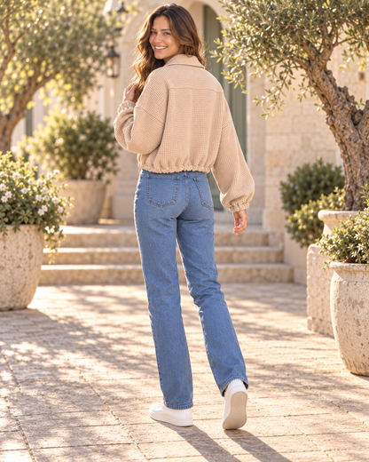 Back view of khaki textured jacket showing cinched drawstring hem