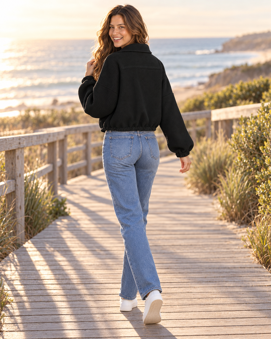 Back view of black textured jacket at golden hour