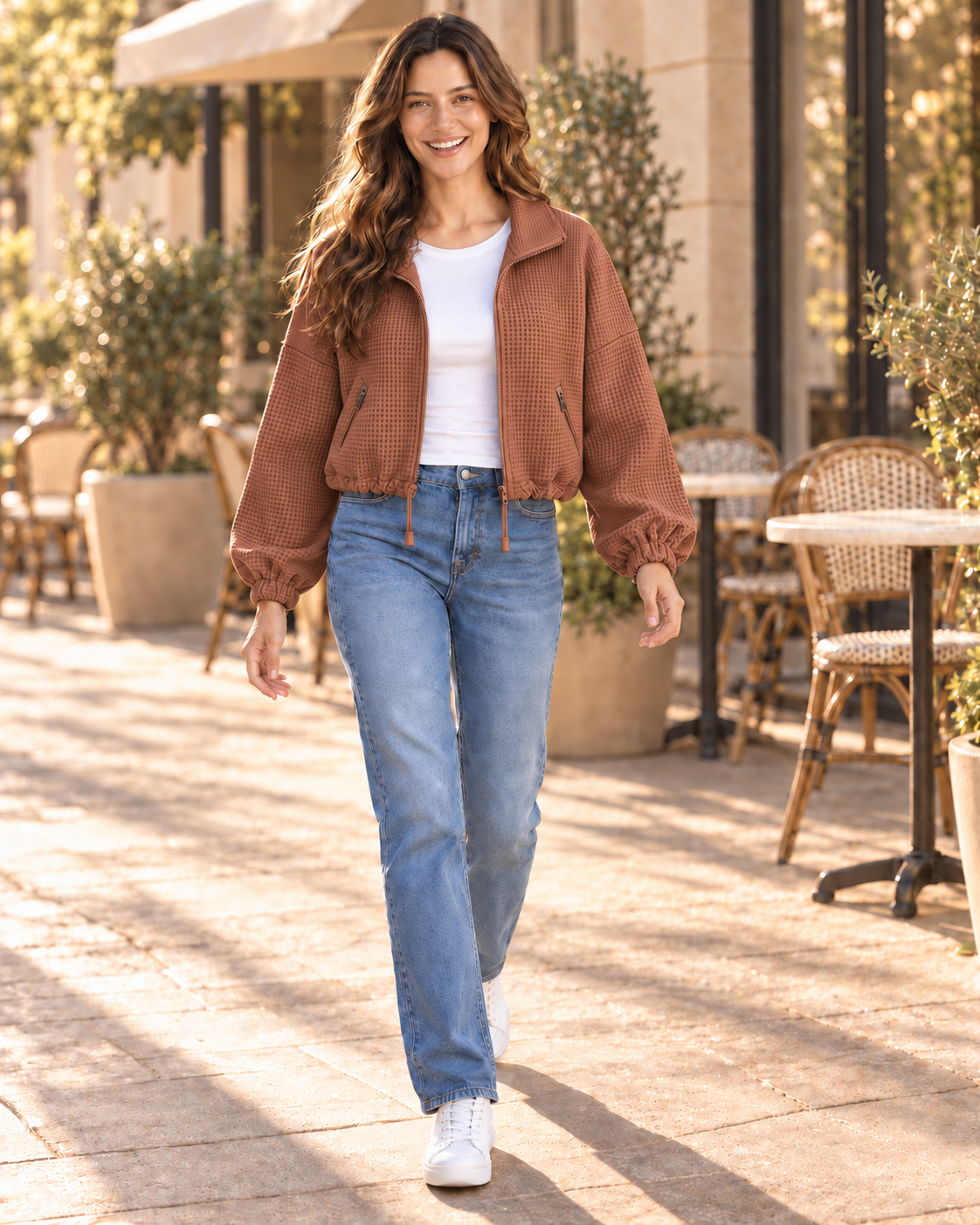 Model in caramel textured zip-front jacket with drawstring hem, front view